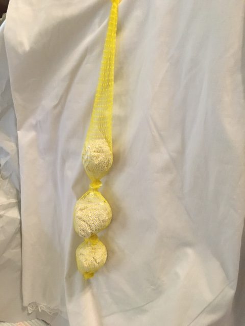White prill beads in yellow netting