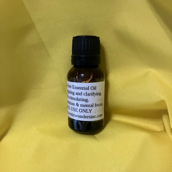 Small brown bottle of Eucalyptus Oil against yellow background